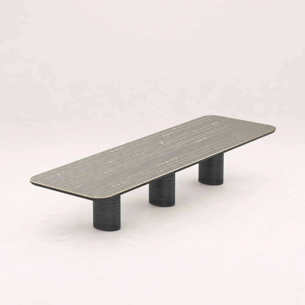 DT01 Dining Table from the X Collection by Eva Szumilas in black wood, with a long rounded rectangular top, linear arrow inlays and three cylindrical supports.
